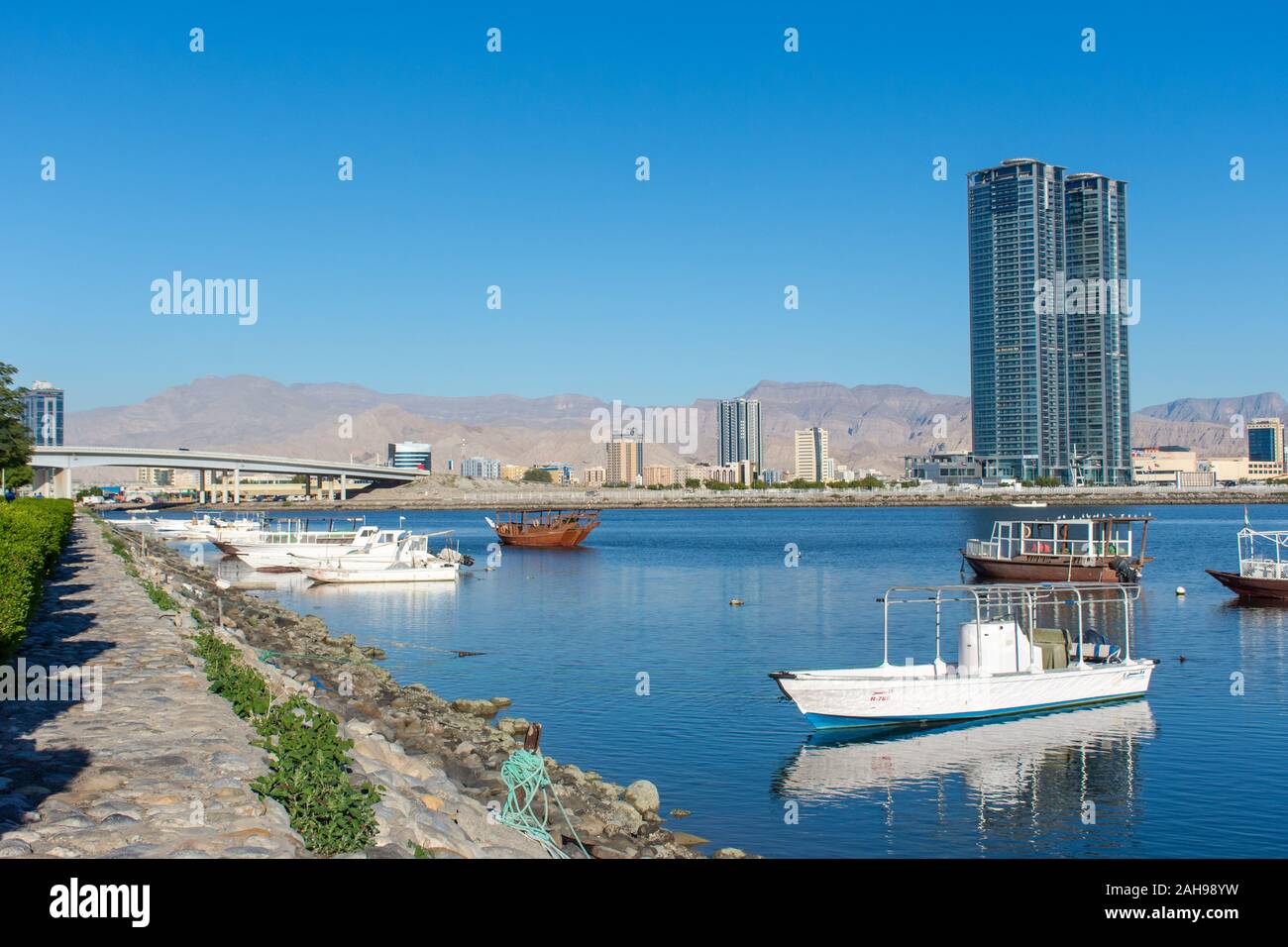 Ras al Khaimah, United Arab Emirates View the mountains and city on a clear blue sky day looking towards the Hajar Mountains. Stock Photo