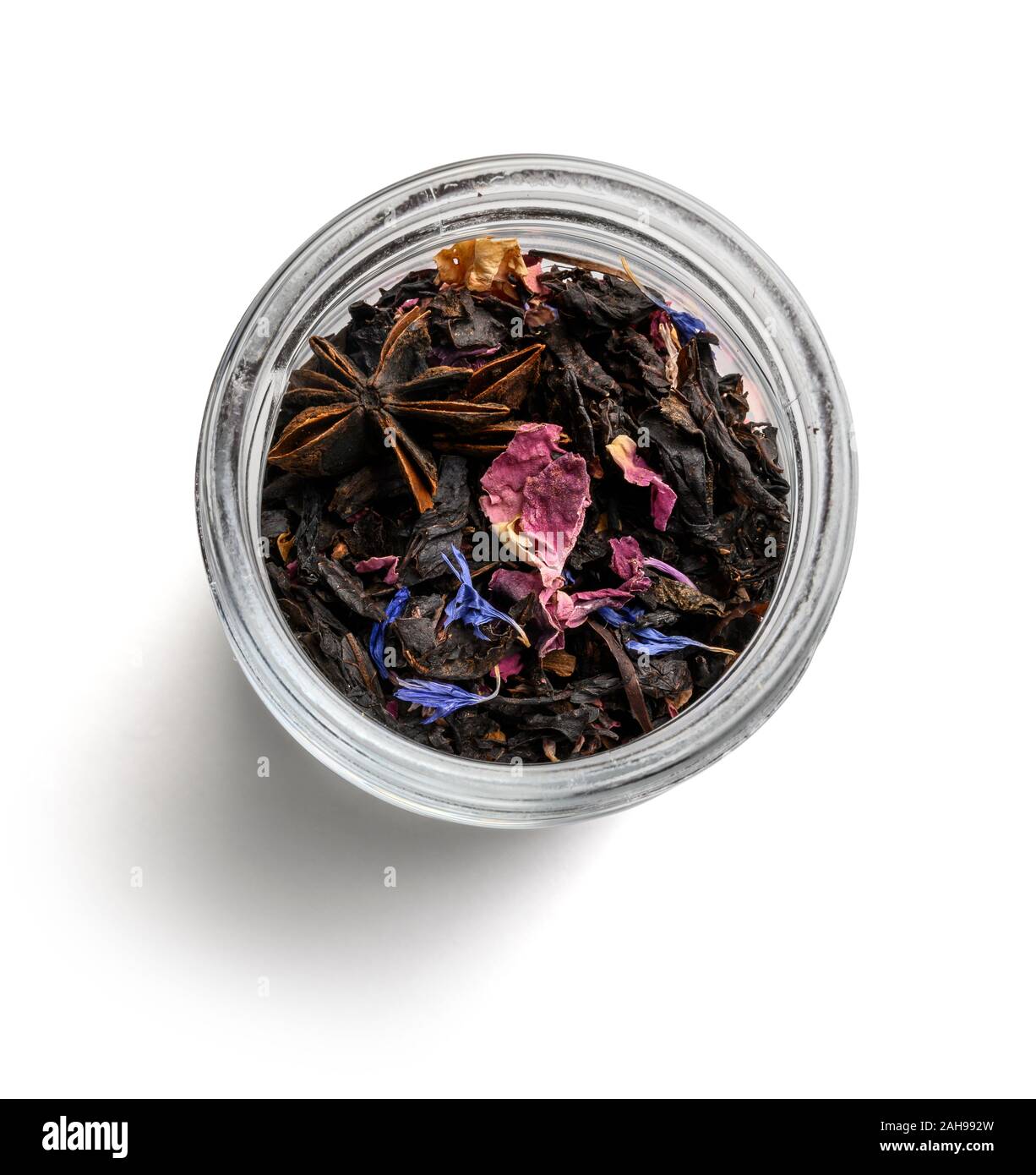Black tea with natural aromatic additives. Top view on white background ...