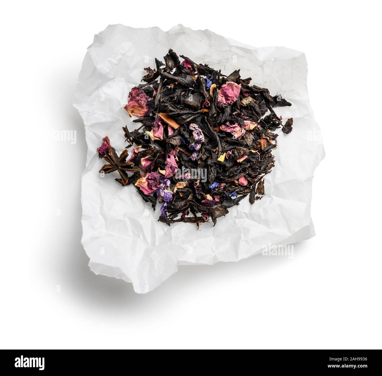 Black tea with natural aromatic additives. Top view on white background ...