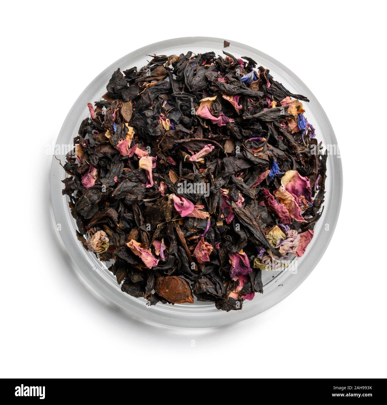 Black tea with natural aromatic additives. Top view on white background ...