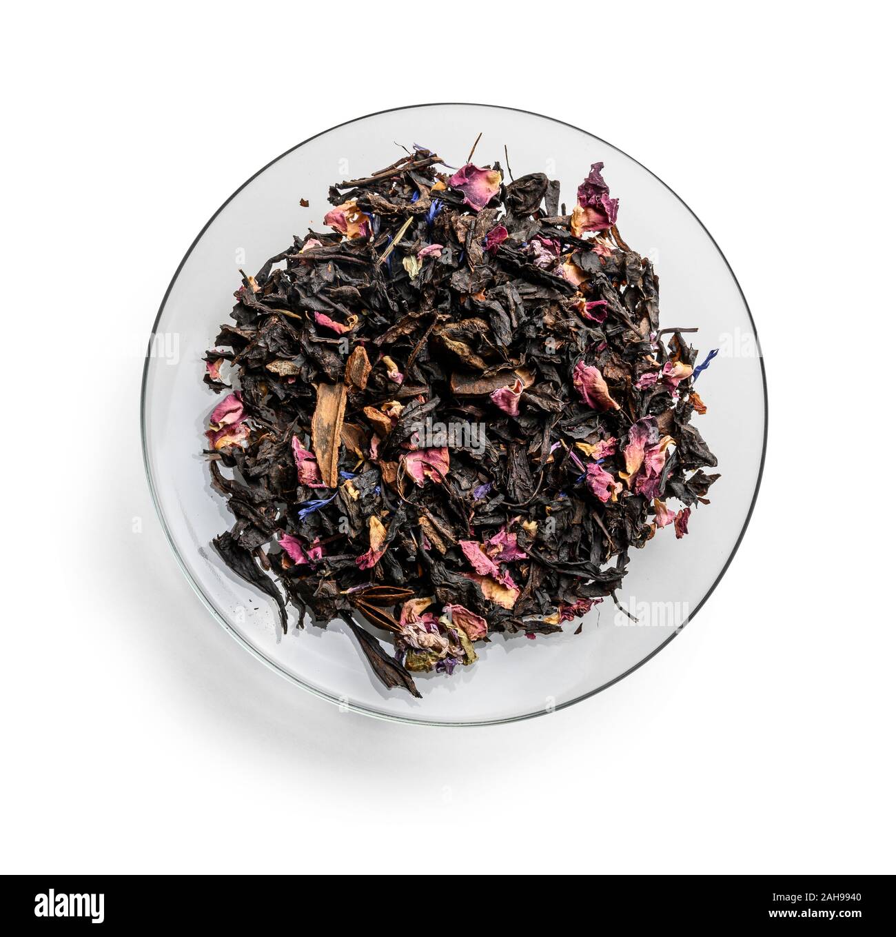 Black tea with natural aromatic additives. Top view on white background ...
