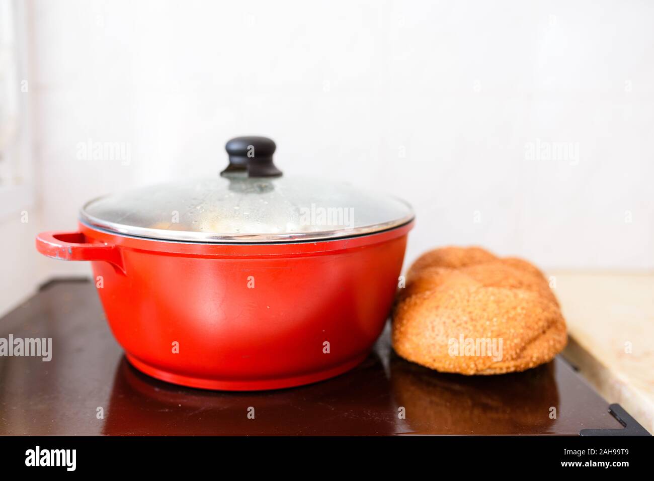 Hot plate for the Sabbath. Pot with traditional food and challah-special  bread in Jewish cuisine. Traditional food Jewish Shabbat Stock Photo - Alamy