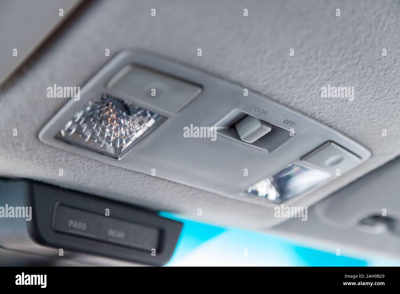 Lighting control inside the car from the top on the instrument panel behind the rearview mirror