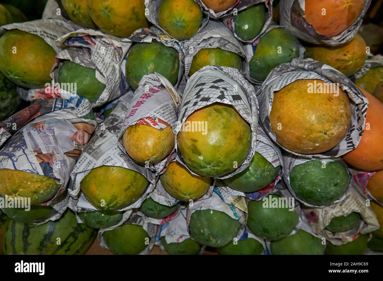 Inside Pasar Tanjung, fresh mangos, papaya for sale, all from local stalls, sellers.  In Tawau, Sabah, Borneo, Malaysia. Stock Photo