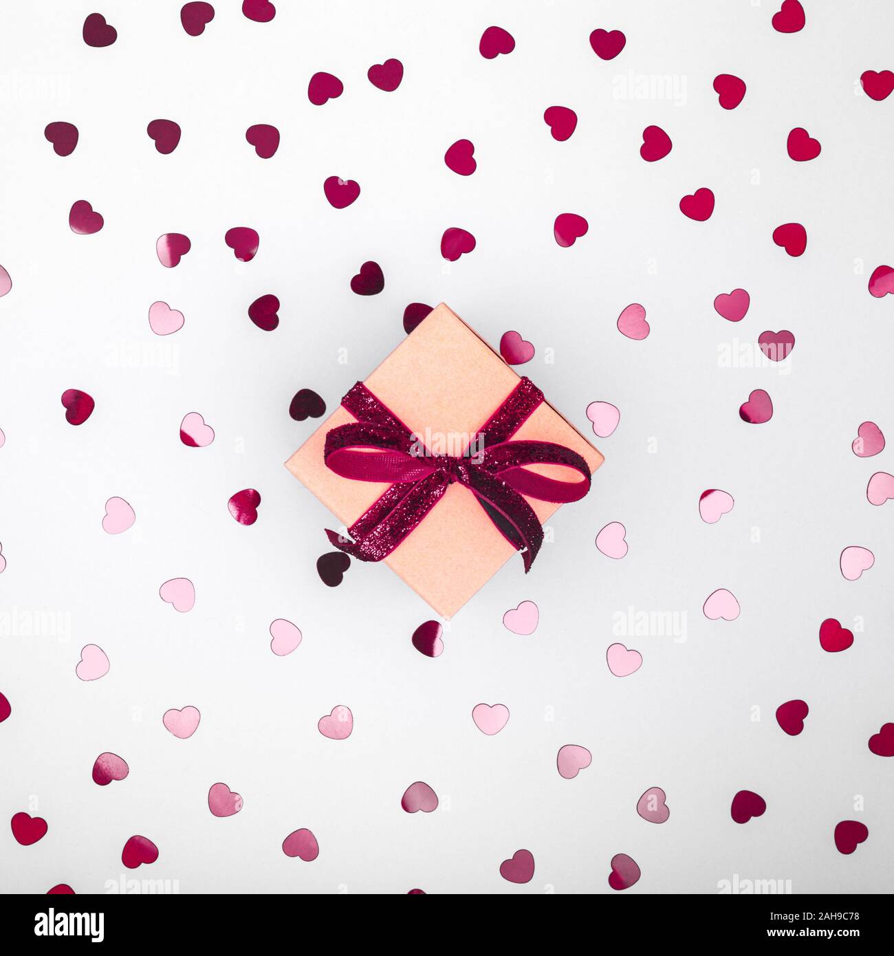 Craft box with dark red velvet ribbon bow and glitter heart confetti ...