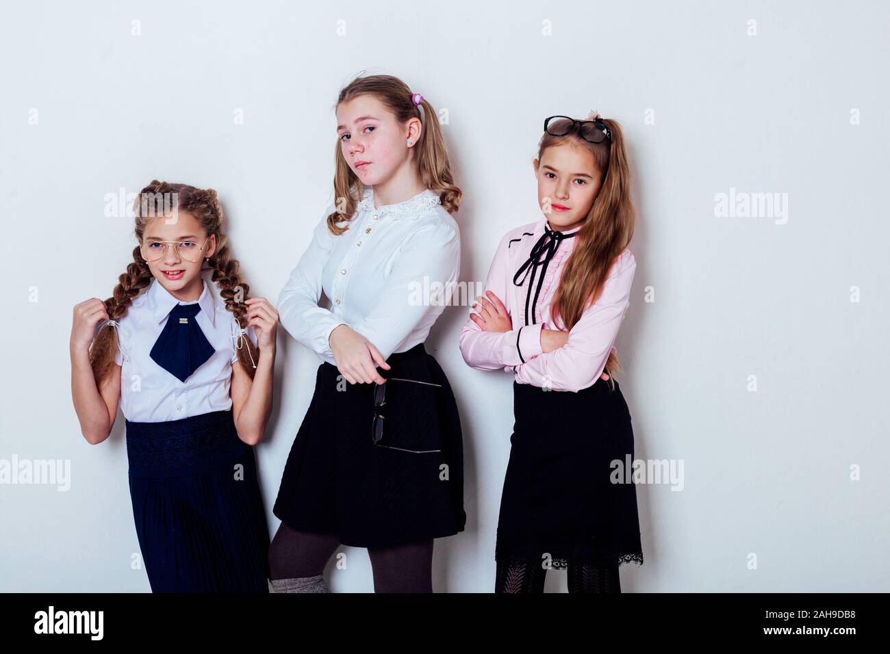 three girls at school boards in the classroom lesson Stock Photo - Alamy
