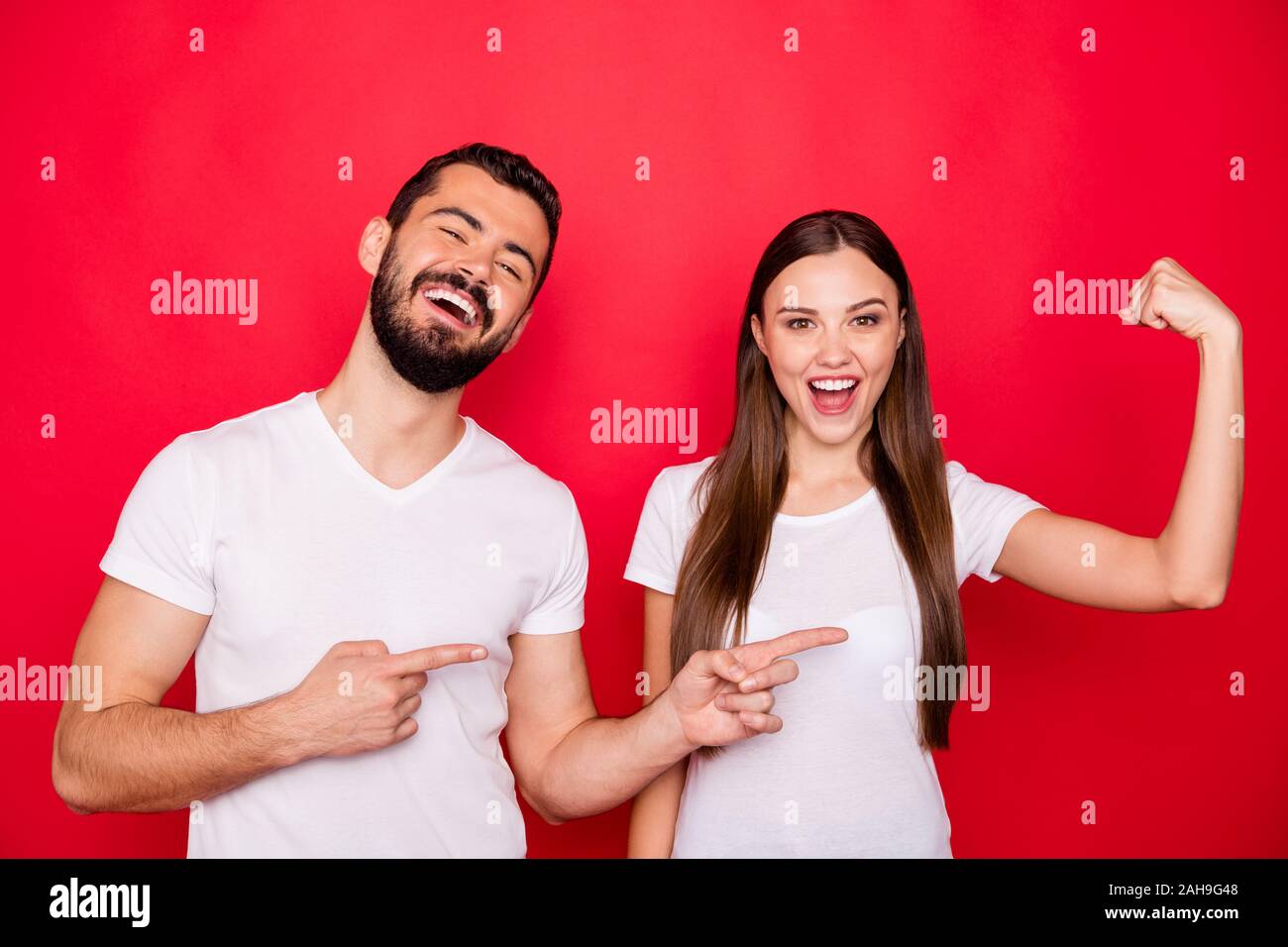 Photo of cheerful cute nice charming pretty sweet style stylish trendy fun  positive couple of two people with girlfriend showing muscles and boyfriend  Stock Photo - Alamy