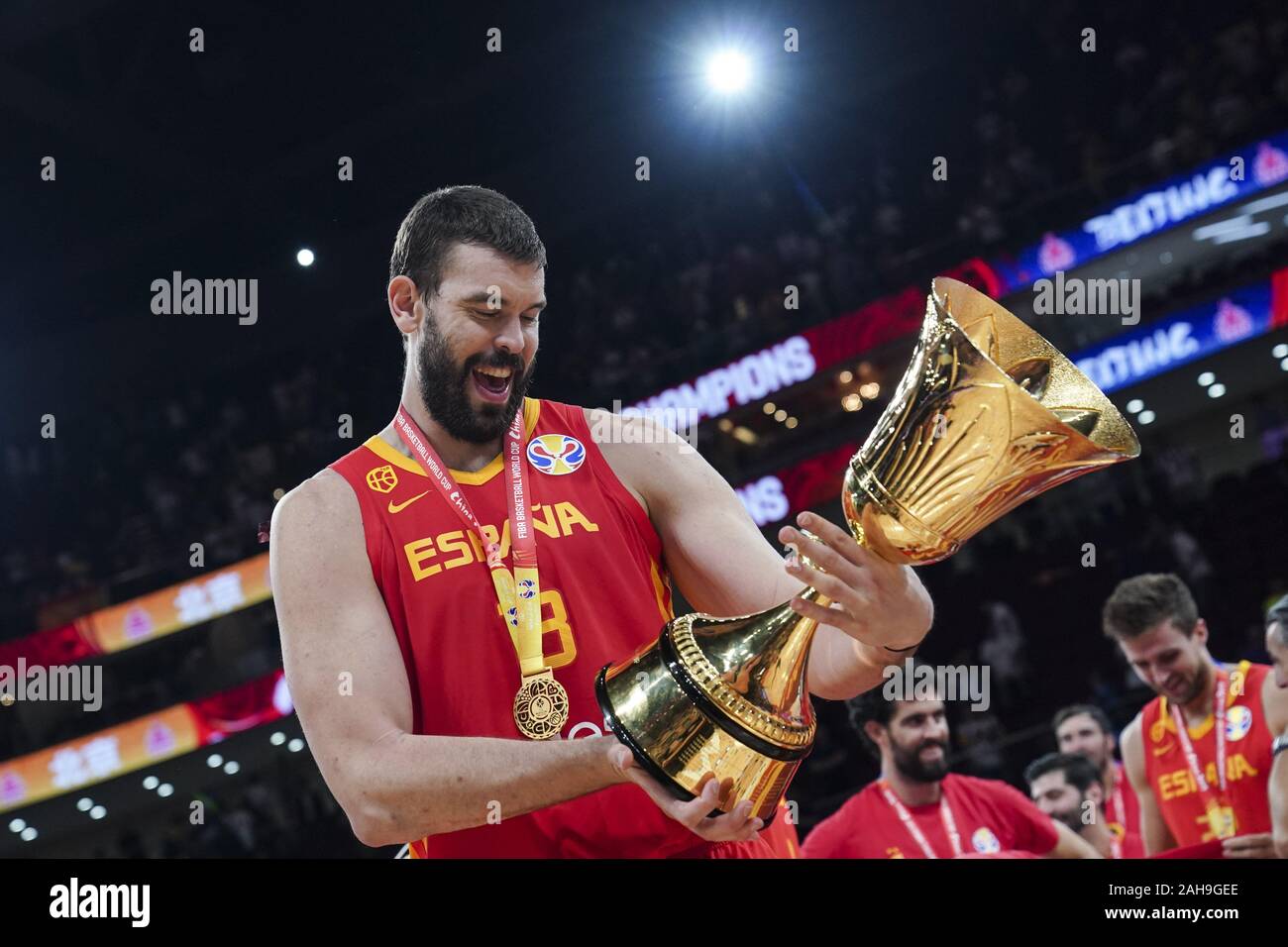 File photo taken on Sept. 15, 2019 shows Marc Gasol of Spain holding the trophy during the awarding ceremony after the final match between Spain and Argentina at the 2019 FIBA World Cup in Beijing, capital of China. Gasol played a pivotal role in Spain's triumph at the FIBA World Cup in September, a few months after he helped the Toronto Raptors win their first NBA championship. The 2.15-meter center was selected in the World Cup's All-Star Team, and along with Lamar Odom, is one of only two players to win an NBA title and the World Cup in the sam Stock Photo