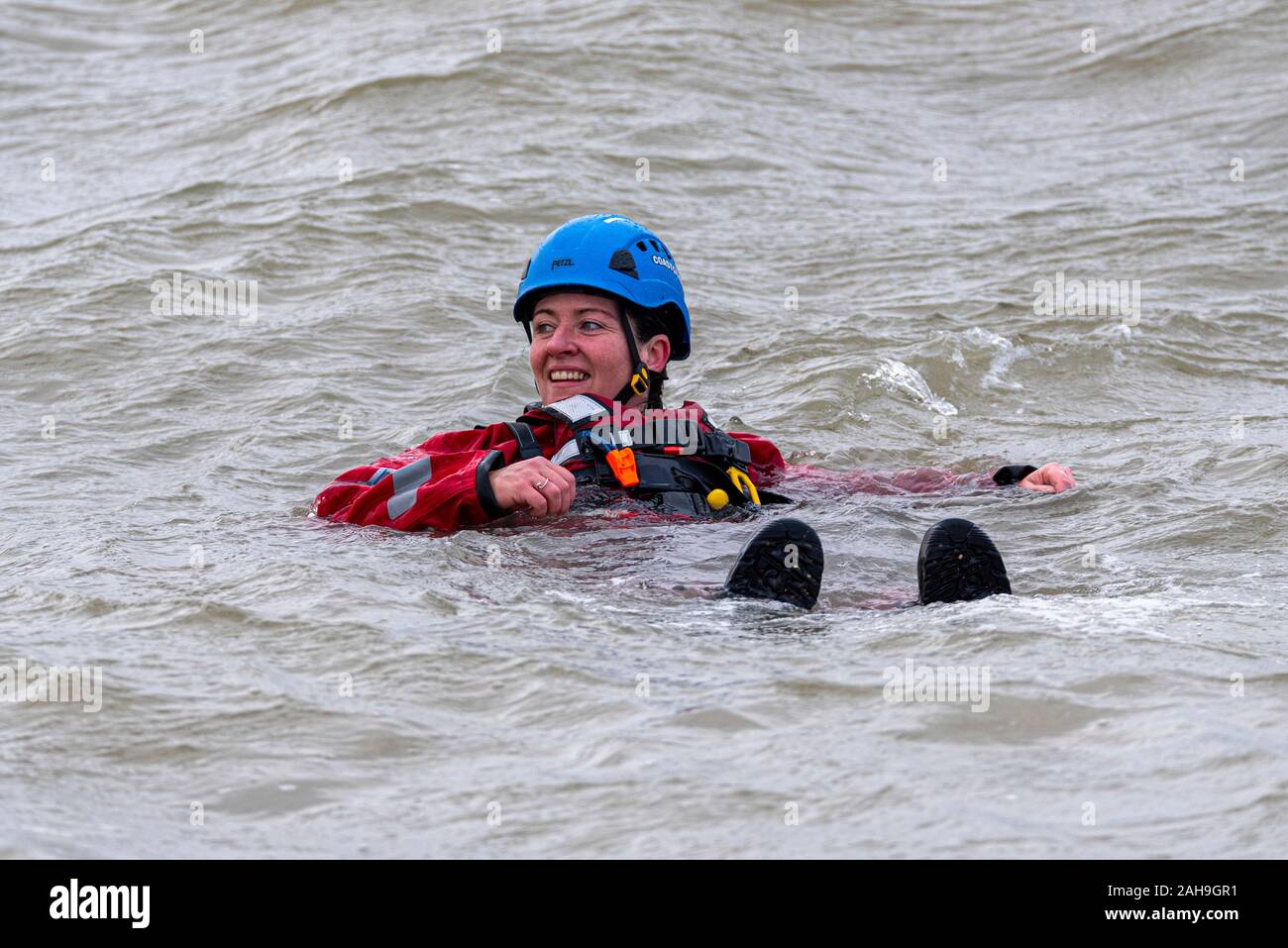 Station Officer Sarah Jane Coombes, Safety crew female at the RNLI Southend Boxing Day Dip swim in the Thames Estuary, Southend on Sea, Essex, UK Stock Photo