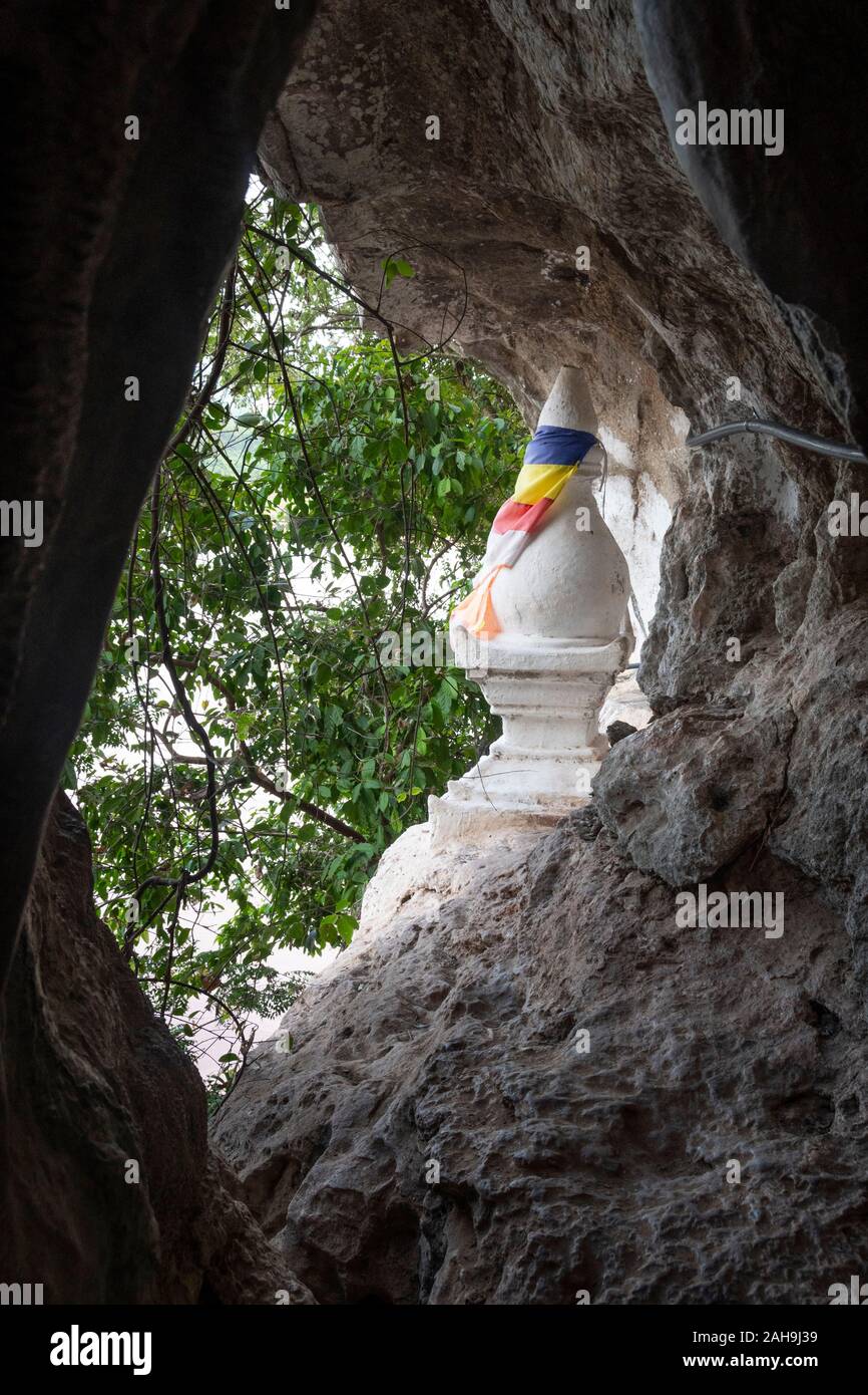 Stupa in cave at Pak Ou, Laos Stock Photo