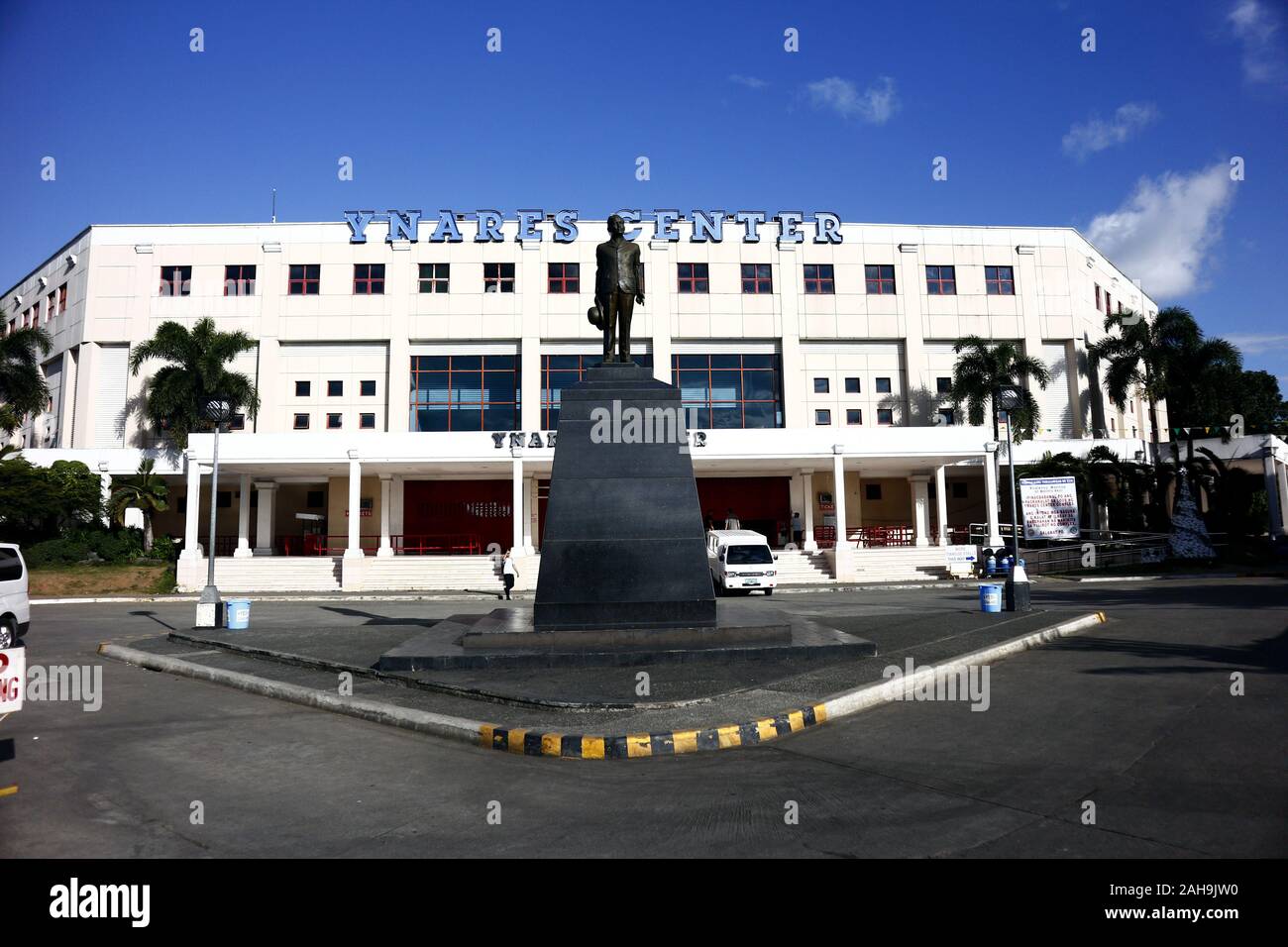 Antipolo City, Philippines – December 19, 2019: Facade of the Ynares Center and a statue of Dr. Jose Rizal in the provincial capitol ground in Antipol Stock Photo