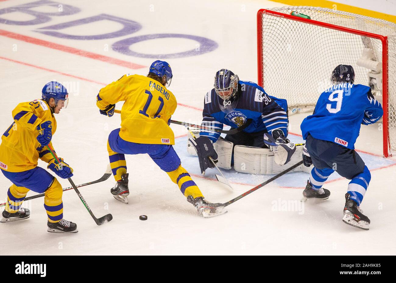 L-R Nils Hoglander and Samuel Fagemo (both SWE) and goalkeeper Justus Annunen and Toni Utunen (both FIN) in action during the 2020 IIHF World Junior I Stock Photo