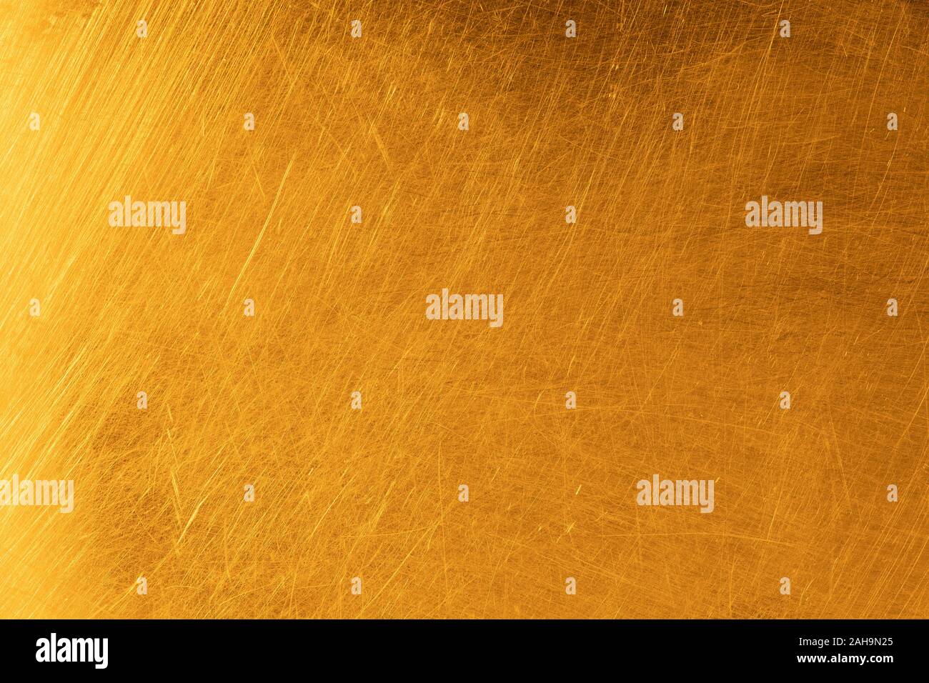 Real gold scratched metal texture background Stock Photo