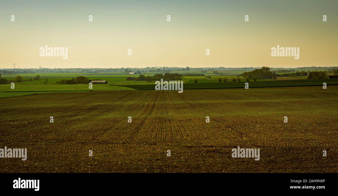 Swedish farmland in early spring when the crops have not yet started to grow. Stock Photo