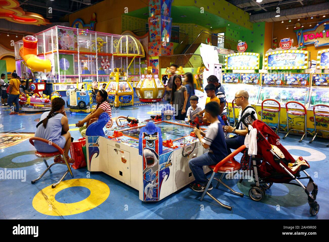 Quezon City, Philippines December 22, 2019 Customers play video