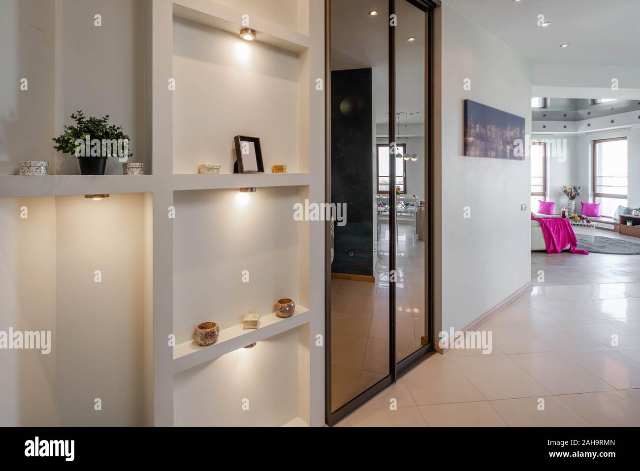 Shelves and wardrobe in entrance hall of luxury apartment. Private ...