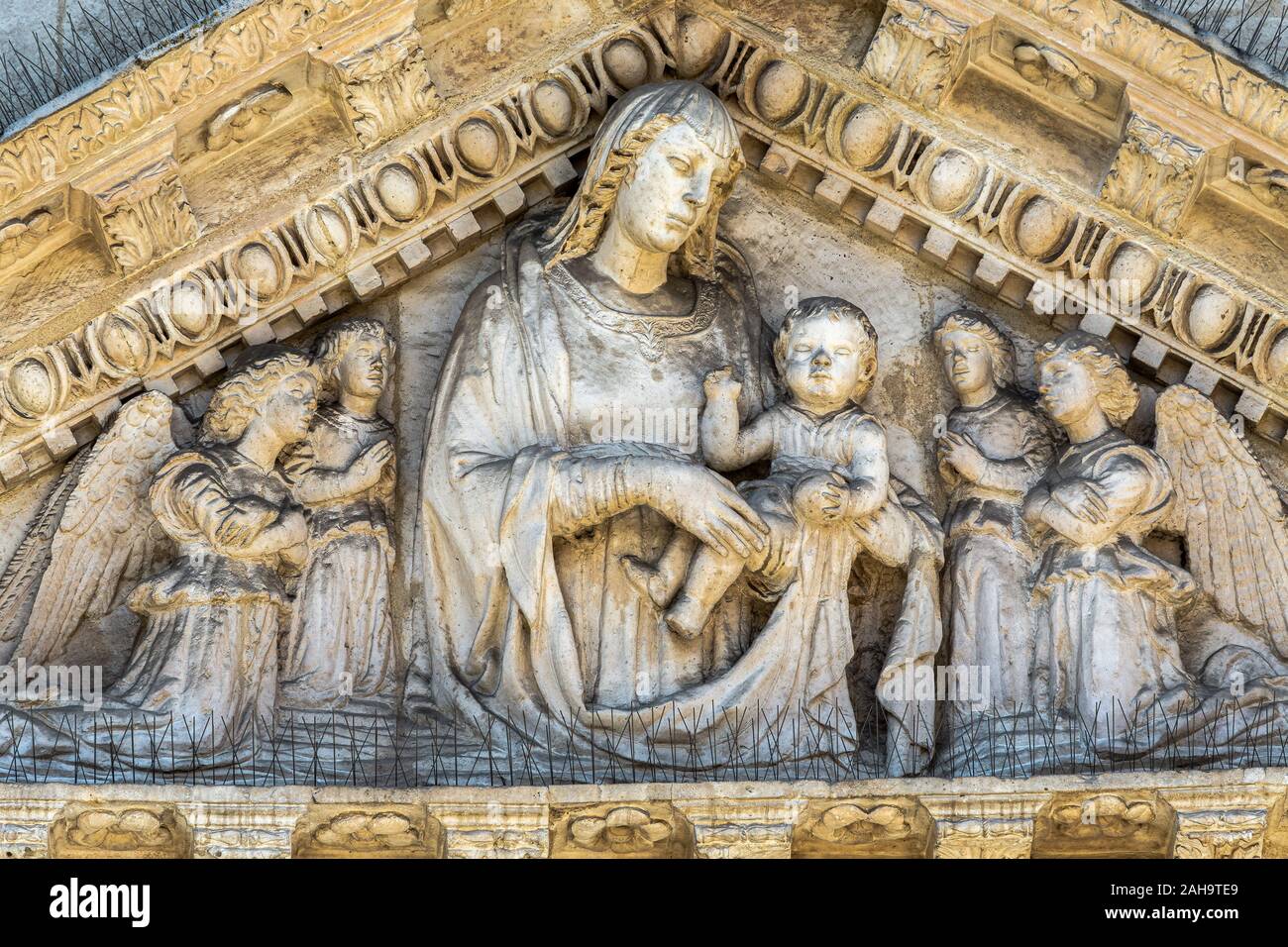 high relief in tympanum. Complex of the Santissima Annunziata ,Sulmona Stock Photo
