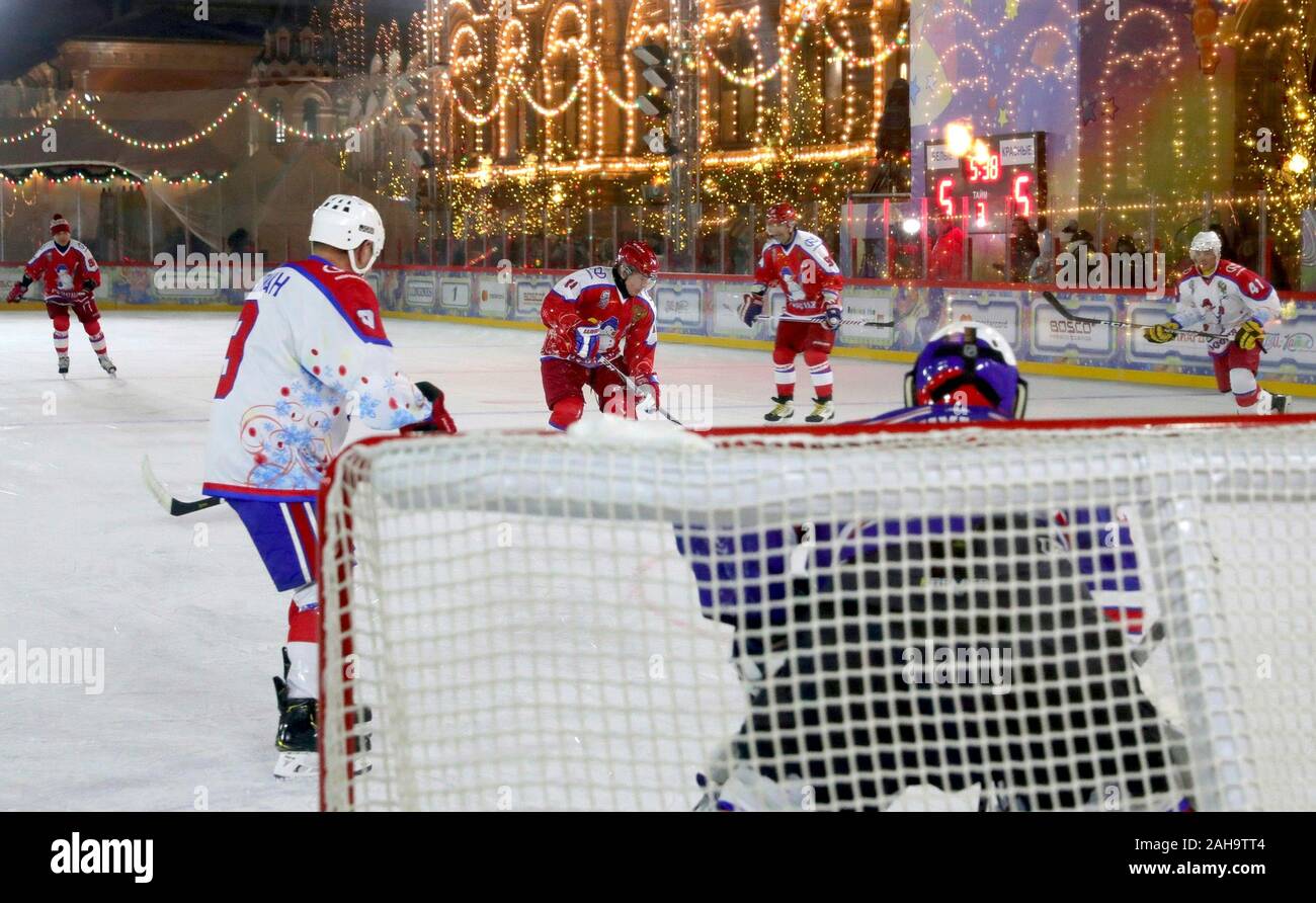 Russian President Vladimir Putin, #11, during a friendly ice hockey match in the Night Hockey League at the GUM Department store ice rink in Red Square December 25, 2019 in Moscow, Russia. Stock Photo