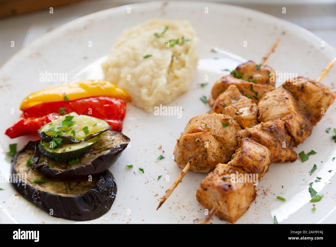 A chicken kebab among Cypriot food served at Limassol in Cyprus. The traditional dish is a