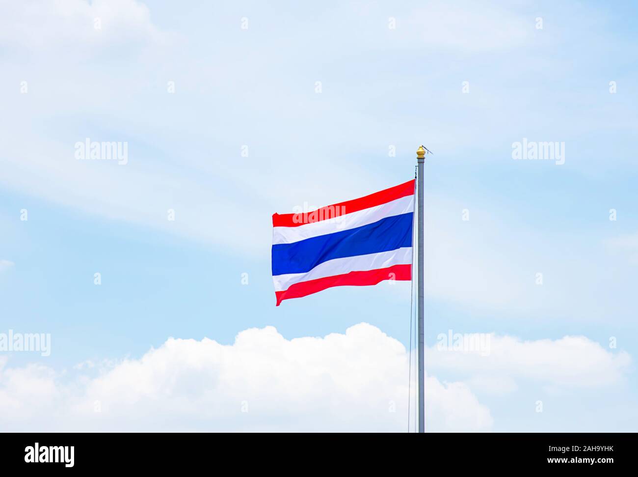 Flag of Thailand on the pole and bright blue sky Stock Photo - Alamy