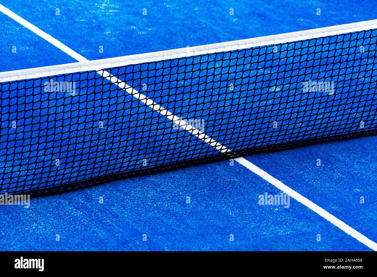 Blue paddle tennis court field with net background Stock Photo - Alamy