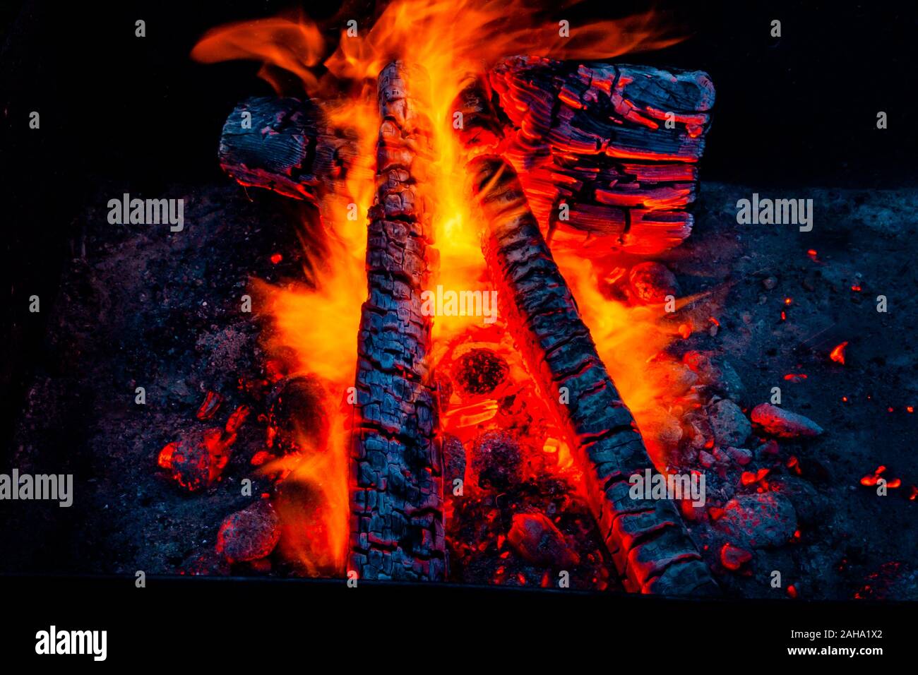 Fiery background. Live coals. Burning firewood. Stock Photo