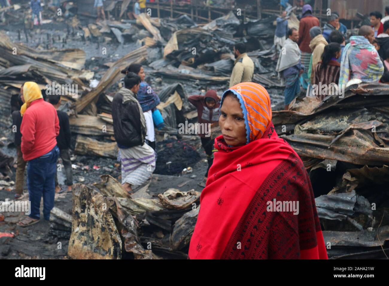 Dwellers at the fire devastated slum in Baunia badh area of Kalshi at Dhaka’s Mirpur.A fire gutted over 100 shanties at a slum in Baunia badh area of Kalshi at Dhaka’s Mirpur. Stock Photo
