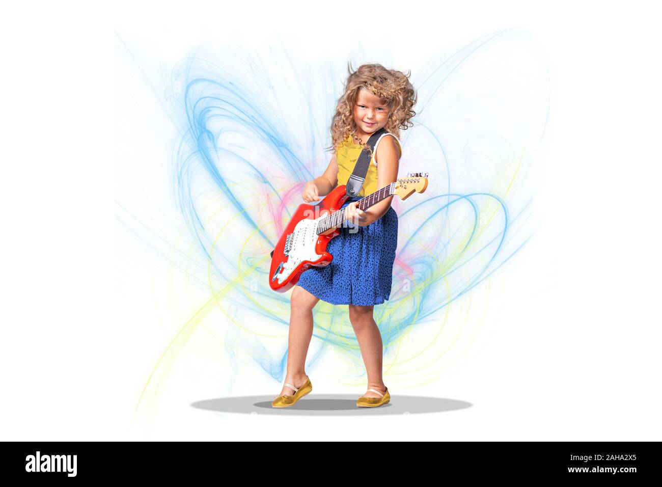 portrait of little girl with a guitar on the stage Stock Photo