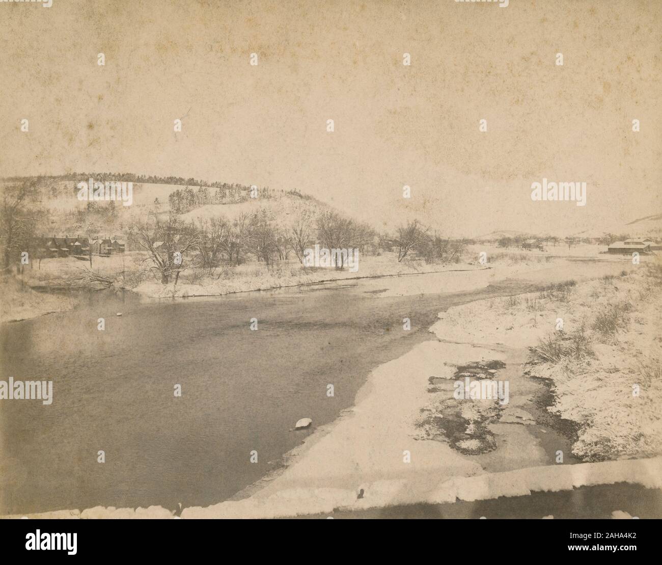 Antique c1890 photograph, “looking up the Chenango River from the New York Susquehanna & Western Railway bridge in winter of 1890-91.” Photo likely taken in town of Chenango Bridge, NY. SOURCE: ORIGINAL PHOTOGRAPH Stock Photo