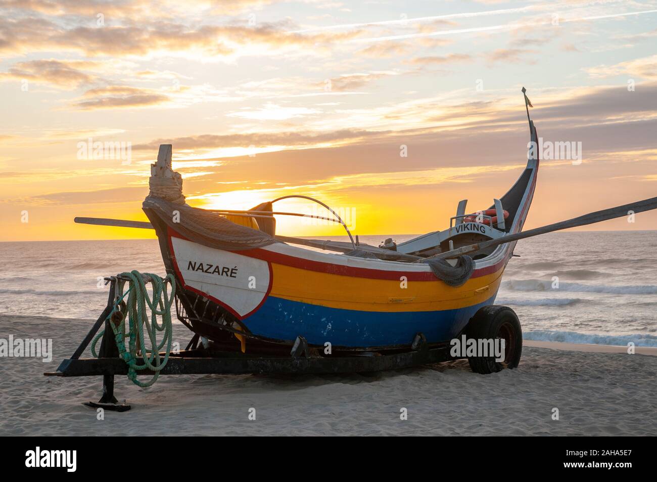 Traditional colorful Portuguese fishing boat on the beach at Vieira de  Leiria. A Portuguese village and also a parish in the municipality of  Marinha G Stock Photo - Alamy