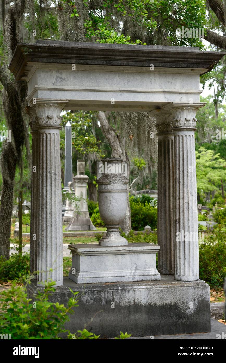 ornate grave,crypt,urn,neo-classical style grave,Graveyard,graves,tombstone,tombstones,cemeteries,historical site,Live Oaks,Quercus virginiana,Spanish Stock Photo