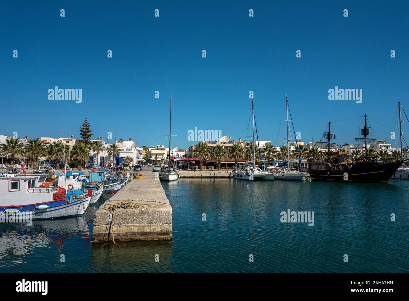 GREECE, KOS - MAY 29: Greece has a large number of islands. View to Kardamena port with ships on 29 May 2019, Kos, Greece. Stock Photo