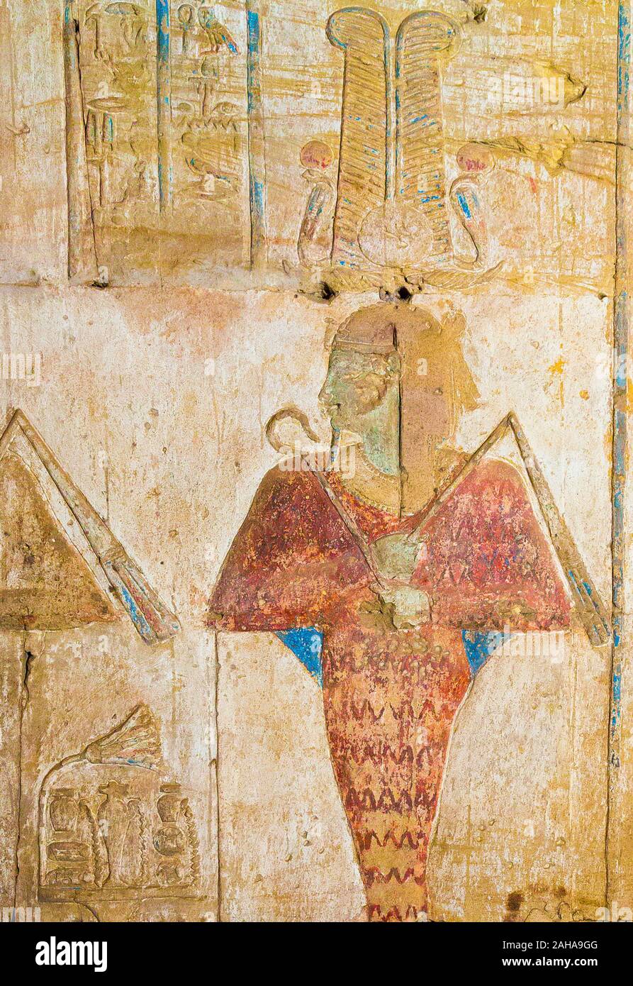 UNESCO World Heritage, Thebes in Egypt, Karnak site, ptolemaic temple of Opet. Osiris god wears a mummy tunique and a crown with 2 feathers. Stock Photo