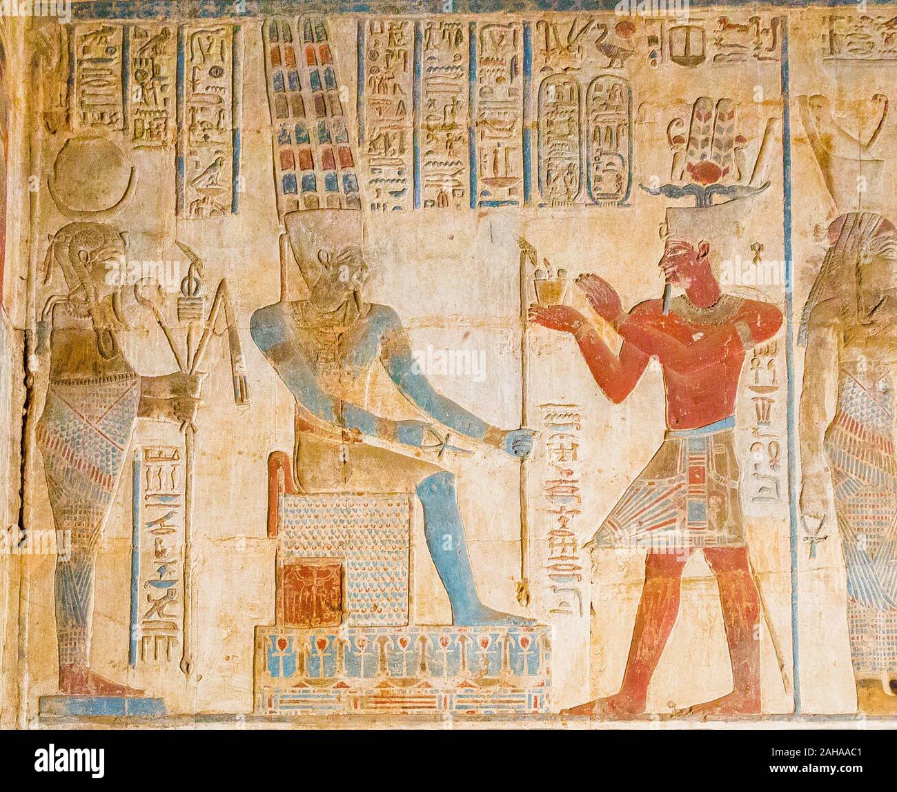 UNESCO World Heritage, Thebes in Egypt, Karnak site, ptolemaic temple of Opet. The king, wearing  a starched loincloth, censes god Amun. Stock Photo