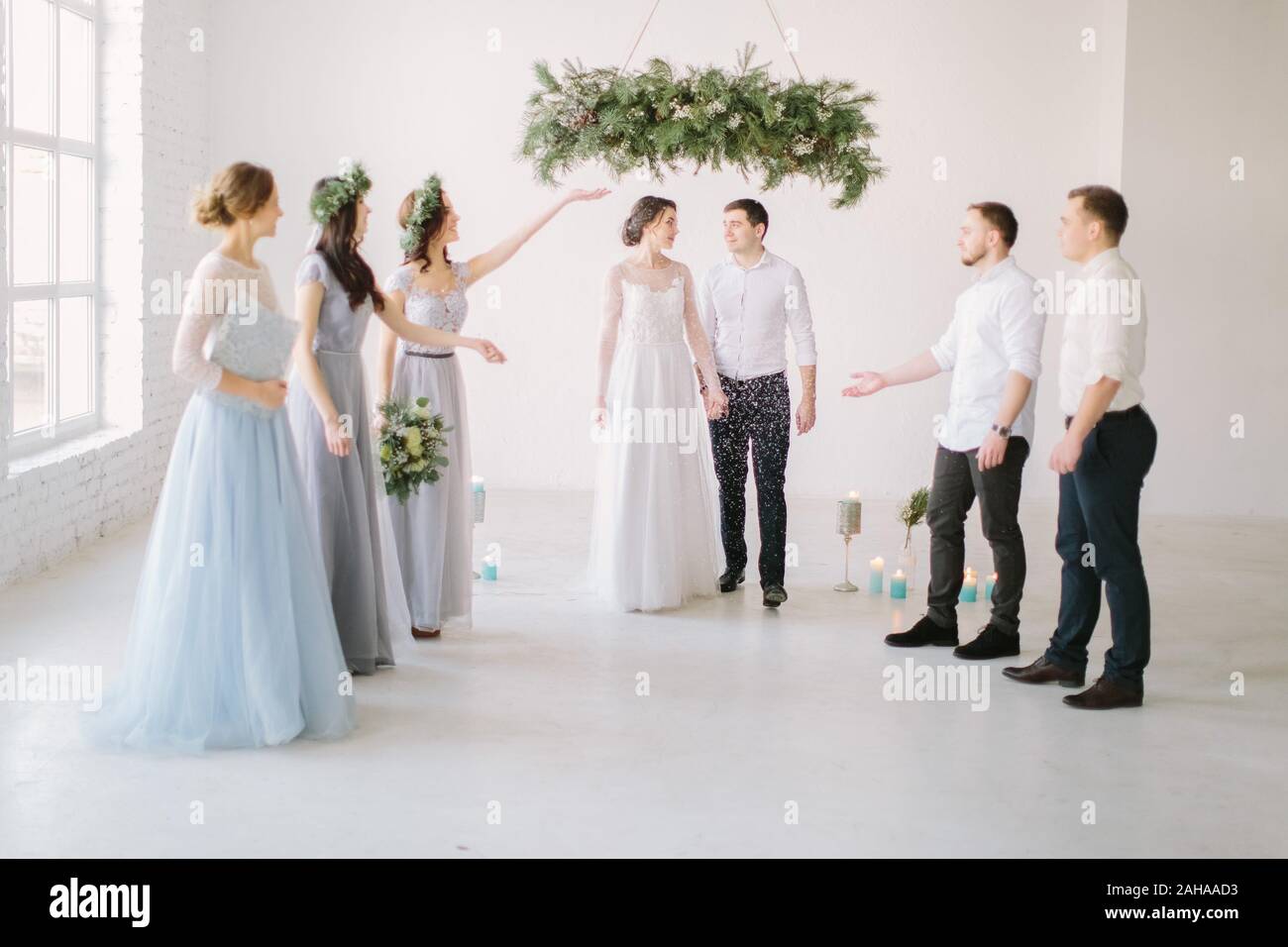 Guests Throwing Confetti Over Bride And Groom At Wedding Stock Photo Alamy