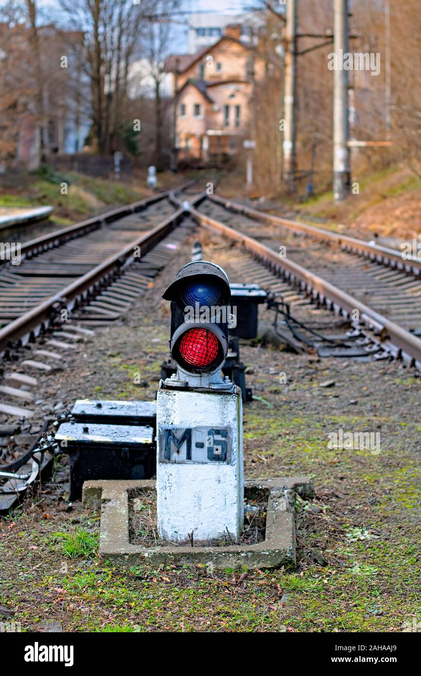 Traffic light shows red signal on railway. Stock Photo