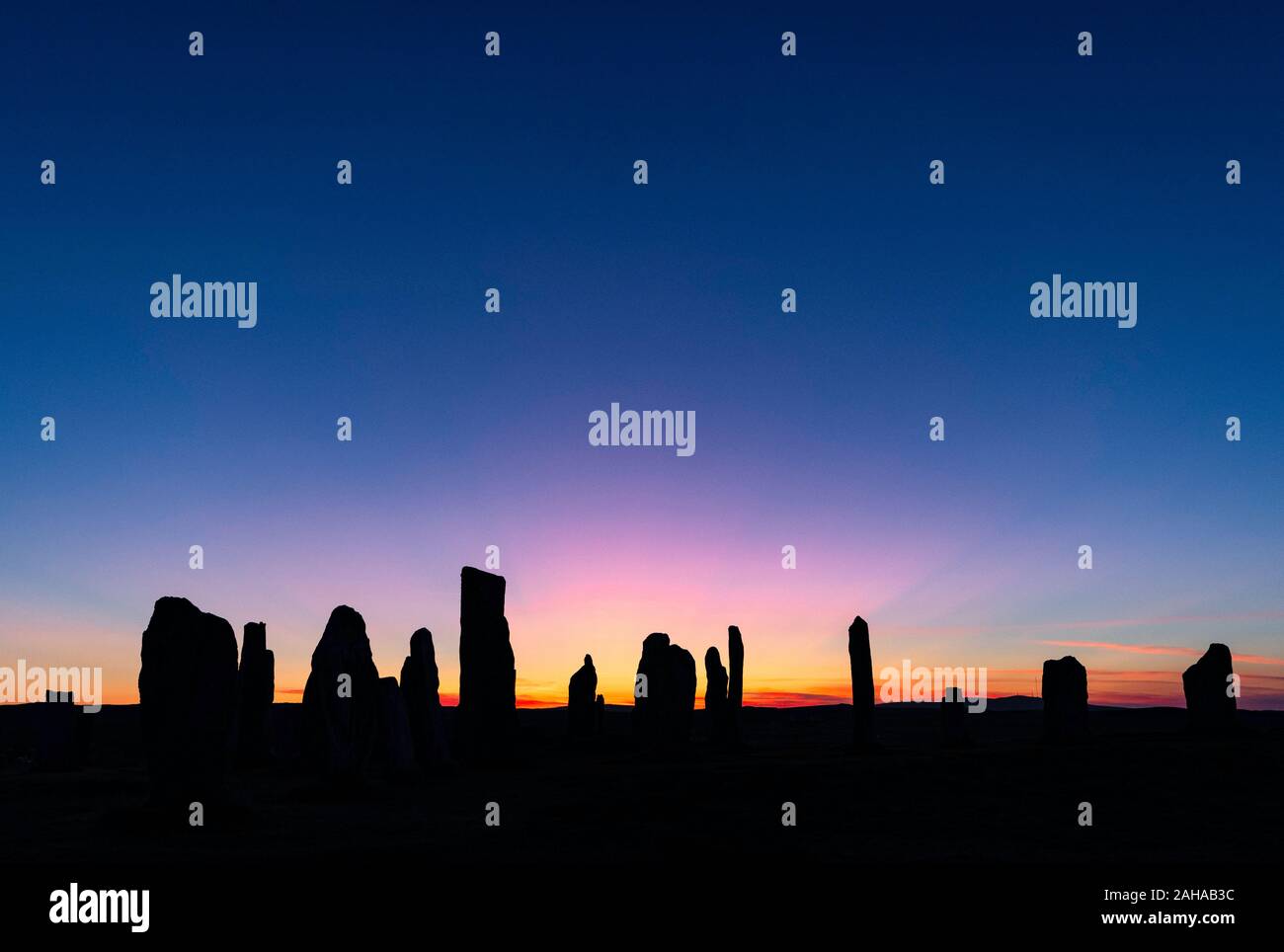 Sunrise over the Calanais Standing Stones, Isle of Lewis, Scotland Stock Photo