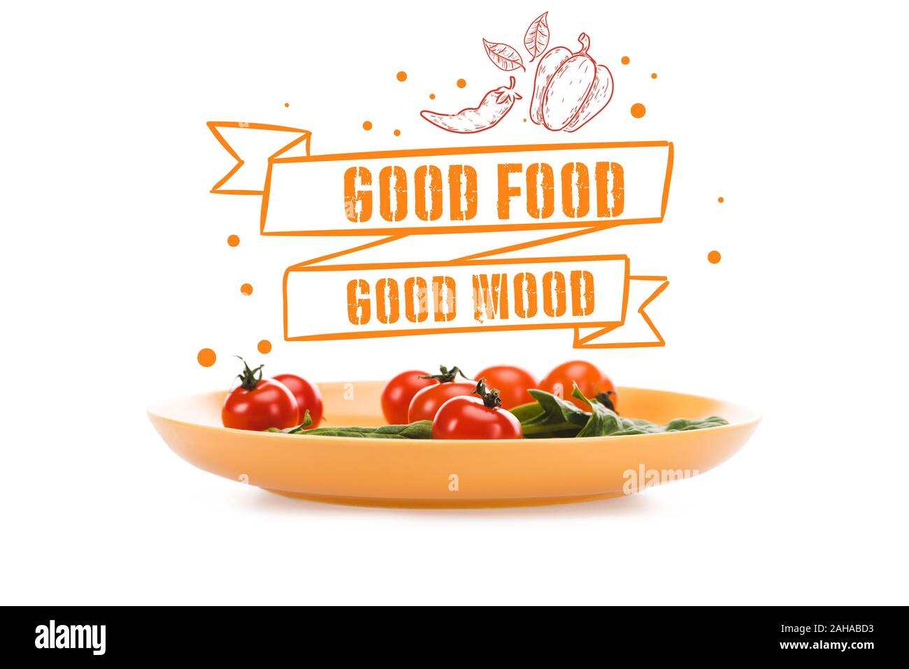 cherry tomatoes with green spinach leaves in yellow plate with good food good mood lettering above isolated on white Stock Photo