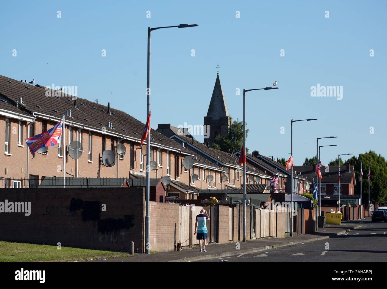14.07.2019, Belfast, Northern Ireland, Great Britain - Protestant part of West Belfast (Conway Street), high walled residential area from the hot time Stock Photo
