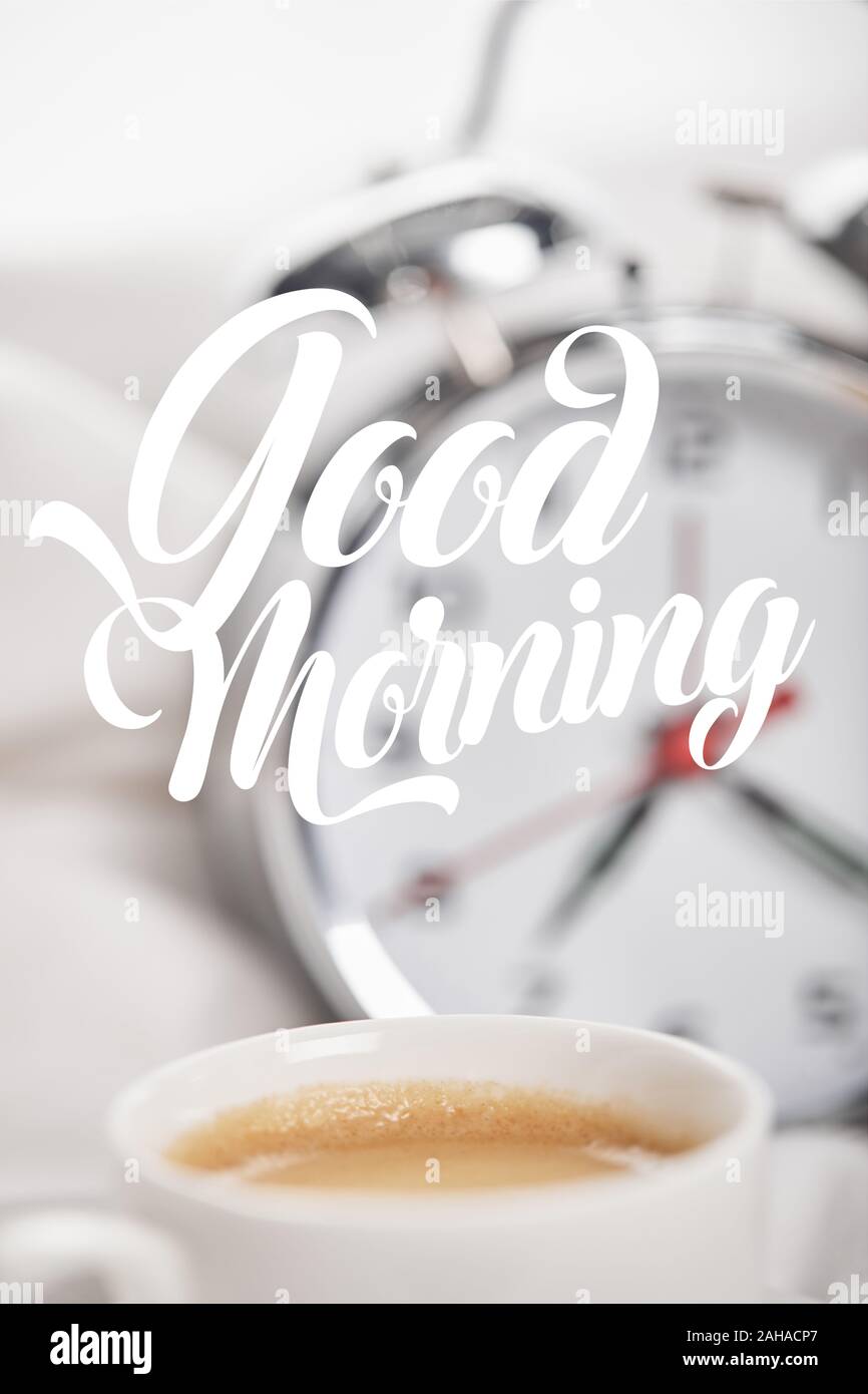 https://c8.alamy.com/comp/2AHACP7/selective-focus-of-coffee-in-white-cup-with-silver-alarm-clock-in-bed-on-background-with-good-morning-illustration-2AHACP7.jpg