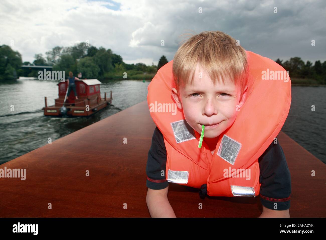 20.06.2010, Berlin, Berlin, Germany - Boy with life jacket looks cheekily at the viewer. 00S100620D005CAROEX.JPG [MODEL RELEASE: YES, PROPERTY RELEASE Stock Photo