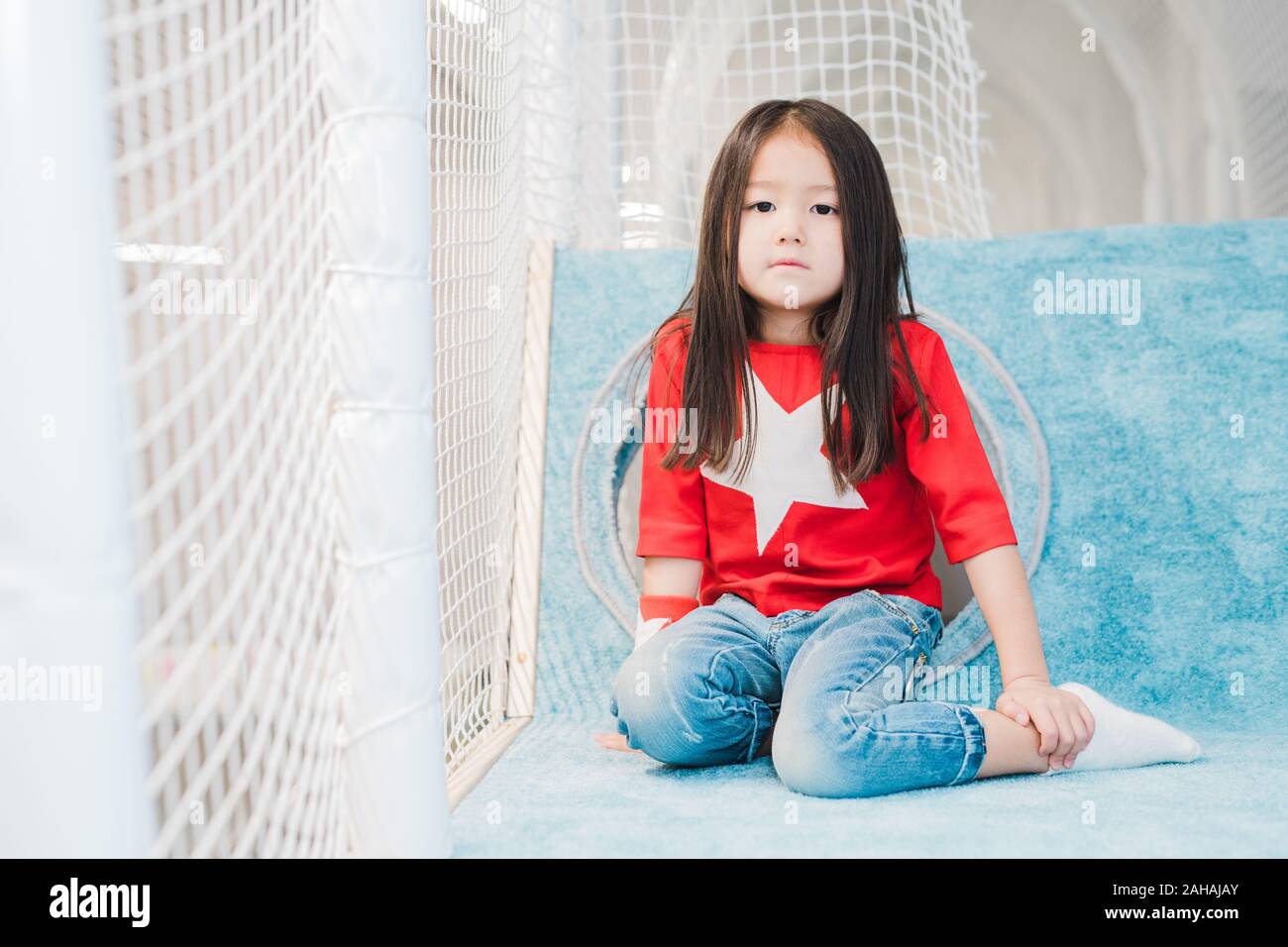 Pretty Little Asian Girl With Long Hair Wearing Costume Of Super Girl Stock Photo Alamy