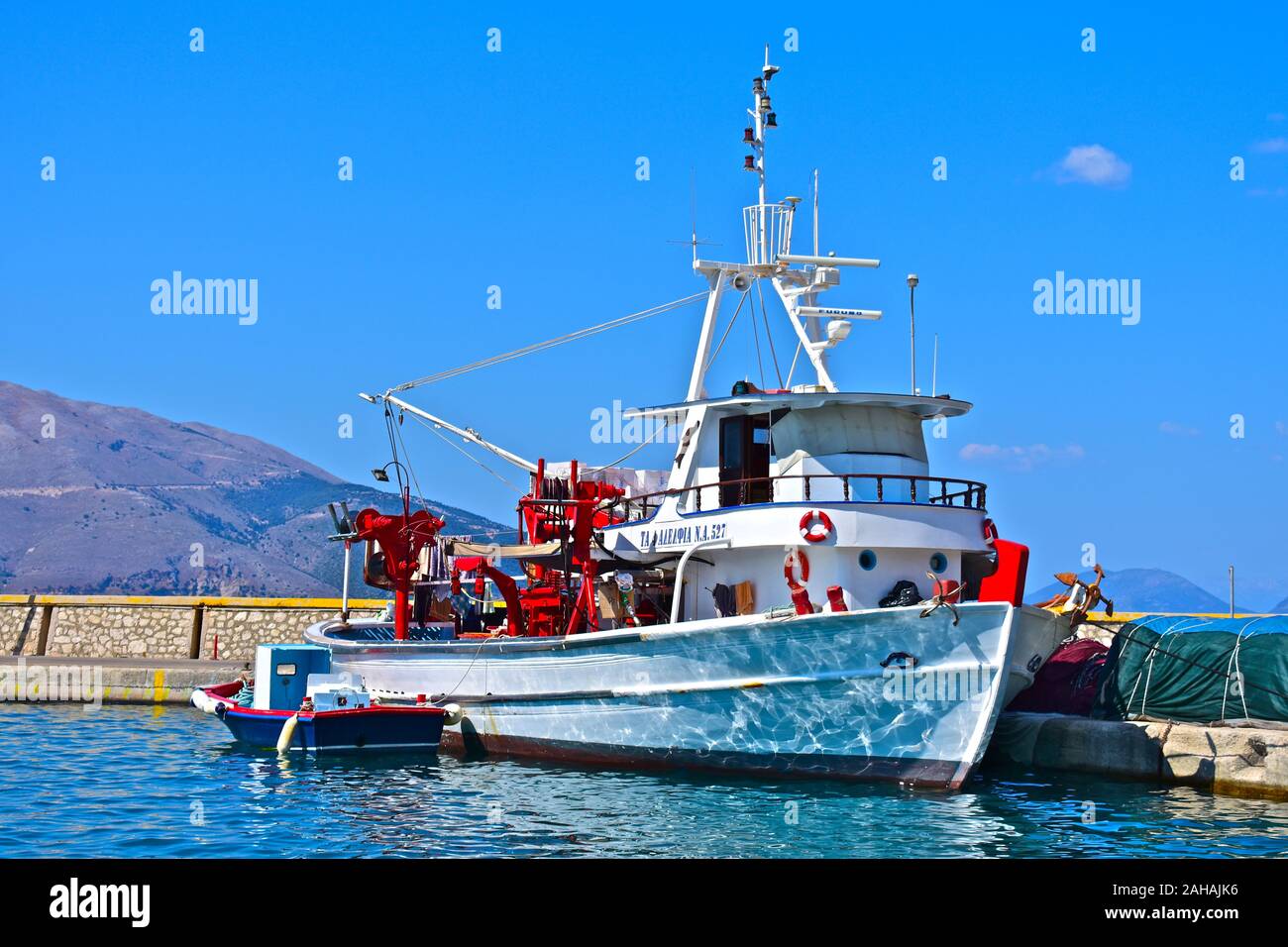 Modern Greek fishing boat moored in the harbour of the beautiful