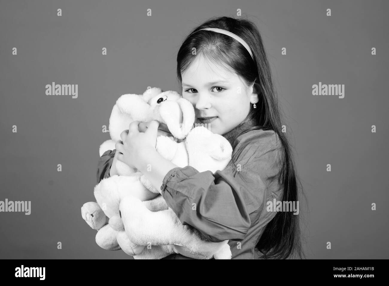 Collecting toys hobby. Cherishing memories of childhood. Small girl