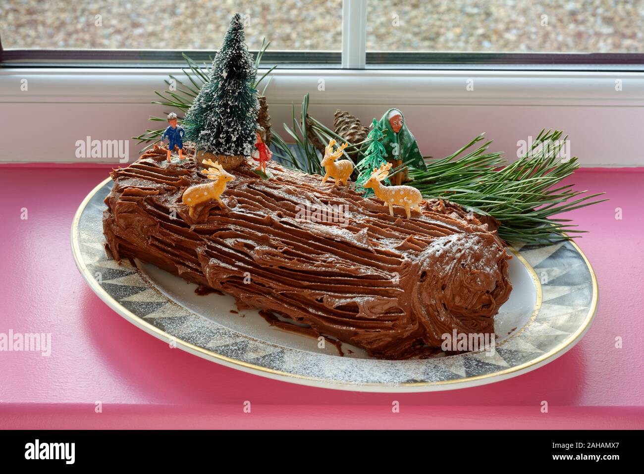 Yule Log also known as Buche de Noel. A chocolate sponge roulade iced with chocoate butter icing. Stock Photo