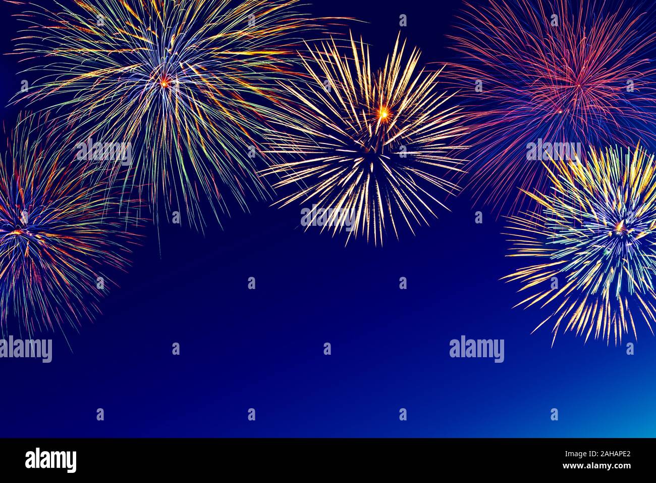 Colorful fireworks over night sky with copy space. Stock Photo