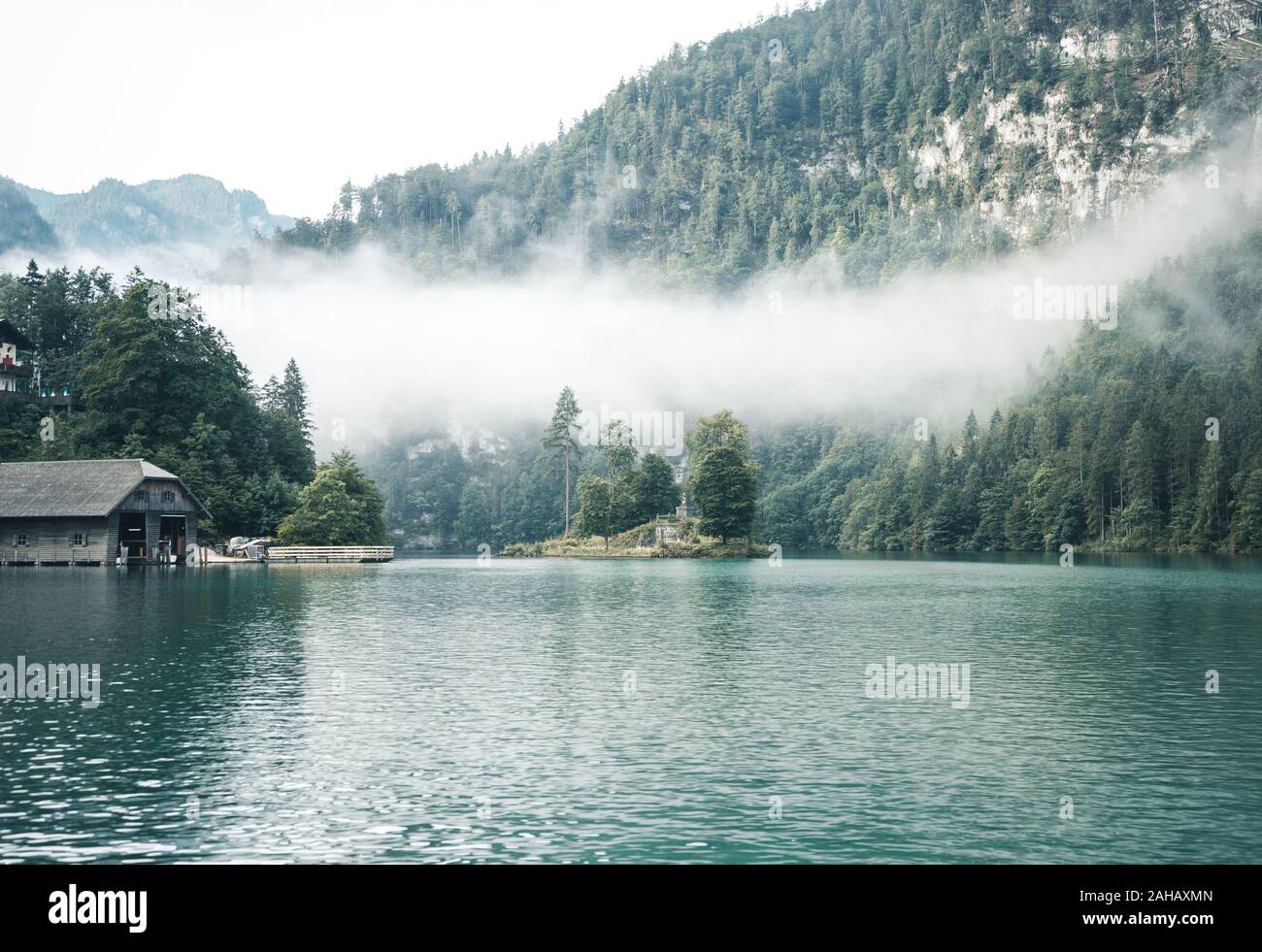The island Christlieger in the fog at the Koenigssee (Königssee) in the Berchtesgadener Land, Bavaria, GermanyThe island Christlieger in the fog at th Stock Photo