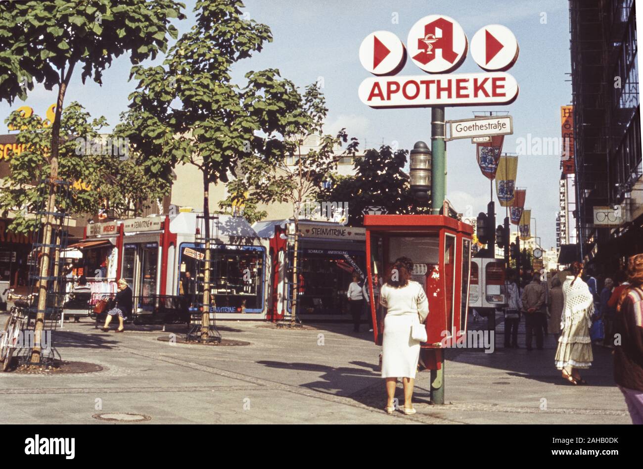 Archival image of the shopping precinct with large Apotheke (pharmacy) signage along Goethestrasse in Berlin Charlottenburg ca.1986, Berlin, Germany Stock Photo