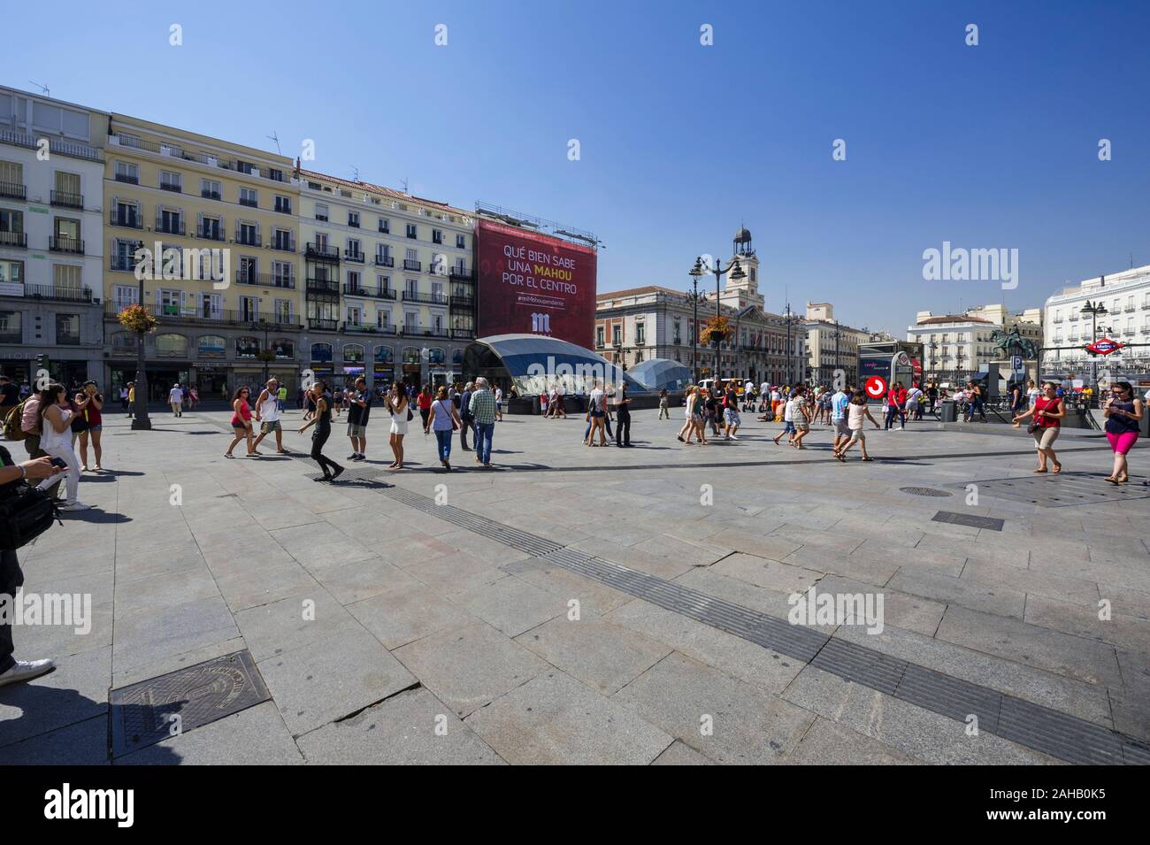 People walking along the Puerta Del Sol in Madrid, Spain Stock Photo