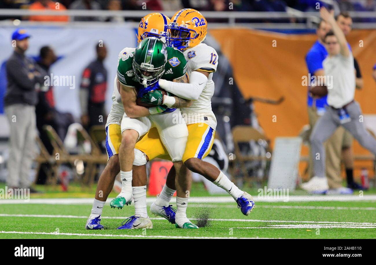 Detroit, Michigan, USA. 26th Dec, 2019. Eastern Michigan Eagles wide receiver Hassan Beydoun (16) fights for additional yardage with Pittsburgh Panthers defensive back Damar Hamlin (3) at the NCAA Quick Lane Bowl game between the Eastern Michigan Eagles and the Pittsburgh Panthers at Ford Field in Detroit, Michigan. JP Waldron/Cal Sport Media/Alamy Live News Stock Photo